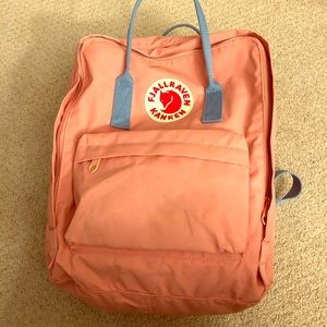 Pink and blue fjallraven backpack.